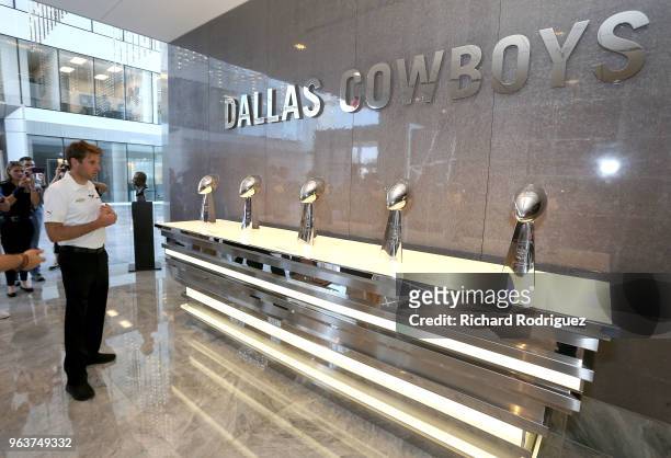 Reigning Indianapolis 500 Champion Will Power looks at the Dallas Cowboys Superbowl trophies on display during a tour of the headquarters and...