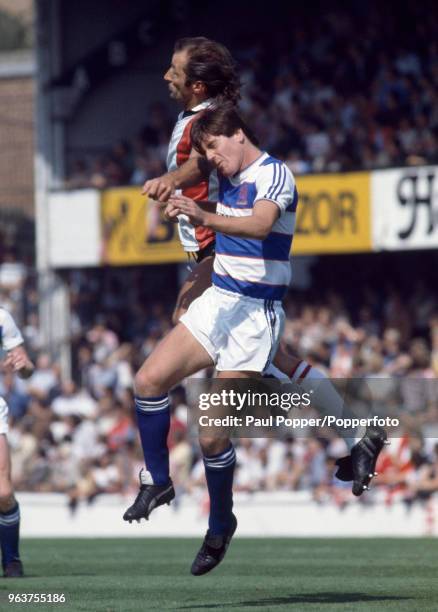 Terry Fenwick of Queens Park Rangers and Frank Worthington of Southampton battle in the air for the ball during the Canon League Division One match...