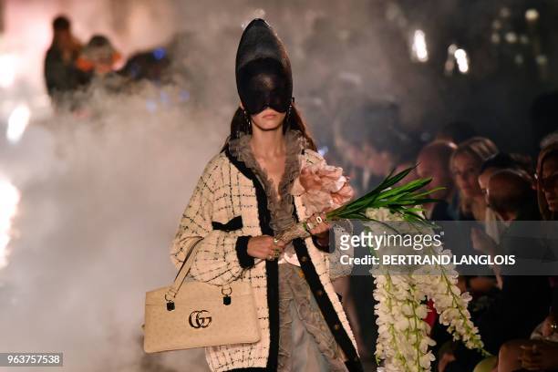 Model presents a creation for Gucci during the 2019 Gucci Croisiere fashion show on May 30, 2018 at Alyscamps in Arles.