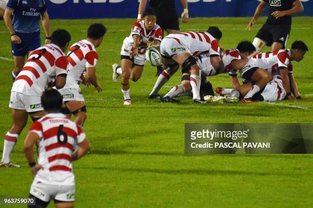 Japan's scrum-half Shinobu Fujiwara pass the ball during the World union Rugby U20 Championship match between New-Zealand and Japan at the Parc des...