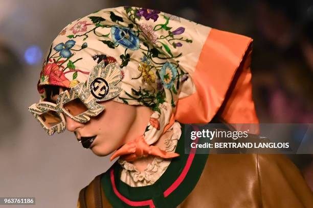 Model presents a creation for Gucci during the 2019 Gucci Croisiere fashion show on May 30, 2018 at Alyscamps in Arles.