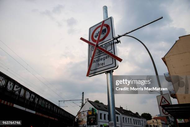 An invalid sign is pictured that bans access for older-model diesel cars on a street on May 30, 2018 in Hamburg, Germany. The city is launching the...