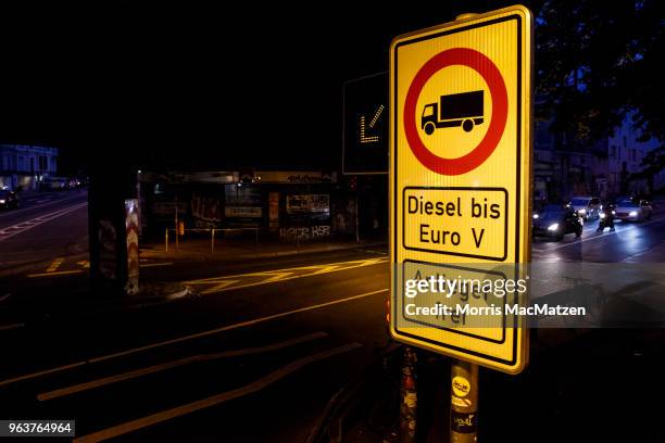 Sign is pictured that bans access for older-model diesel cars on a street on May 30, 2018 in Hamburg, Germany. The city is launching the project on...