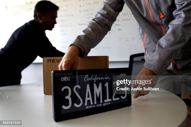 Digital license plate made by Bay Area company Reviver Auto, part of a pilot project with the state Department of Motor Vehicles, is displayed at...