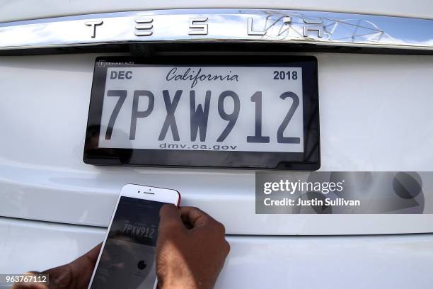 Digital license plate made by Bay Area company Reviver Auto, part of a pilot project with the state Department of Motor Vehicles, is displayed on...