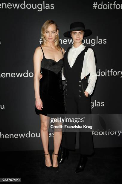 Amber Valletta and Cara Delevigne during the Douglas X Peter Lindbergh campaign launch at ewerk on May 30, 2018 in Berlin, Germany.