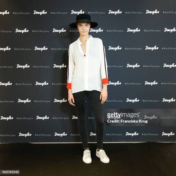 Cara Delevigne attends the Douglas store event on May 30, 2018 in Berlin, Germany.