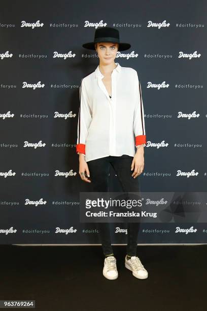 Cara Delevigne attends the Douglas store event on May 30, 2018 in Berlin, Germany.