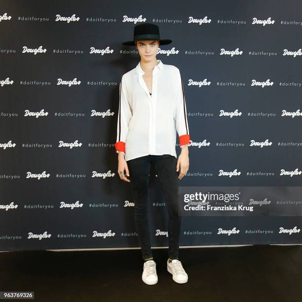 Cara Delevigne attends the Douglas store event on May 30, 2018 in Berlin, Germany.