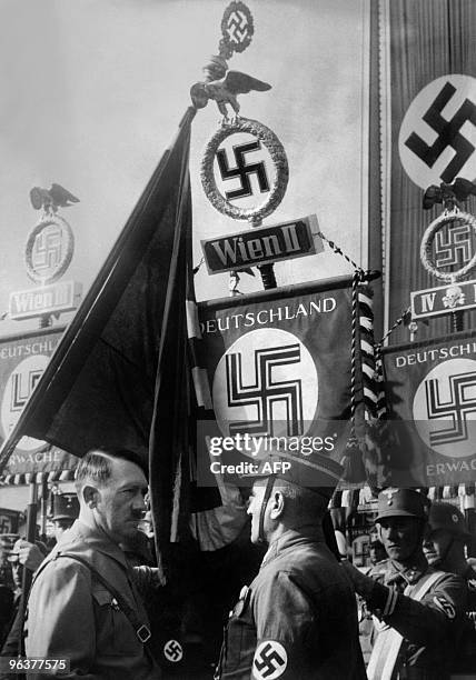 An undated picture shows German Nazi Chancellor Adolf Hitler talking to a soldier during a military ceremony in Vienna after the "Anschluss". From...