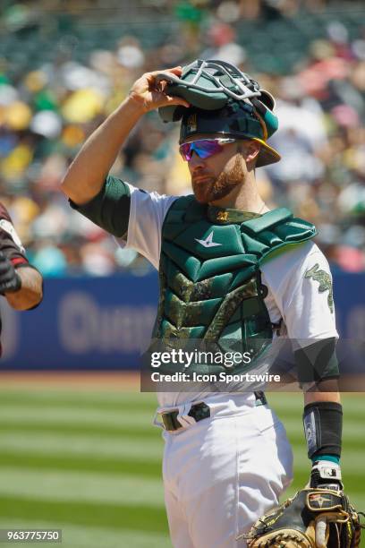 Oakland C Jonathan Lucroy looks towards the Oakland bench during the inter-league game between the Arizona Diamondbacks and the Oakland A's played on...