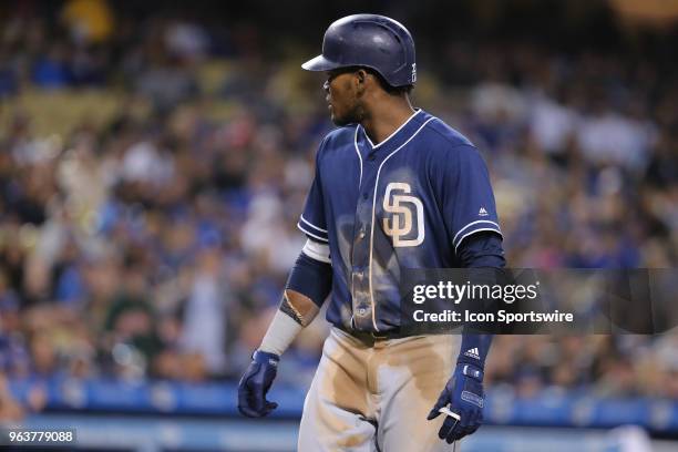 San Diego Padres center fielder Franchy Cordero looks back at the home umpire in shock after being called out on strikes while on his way to first...