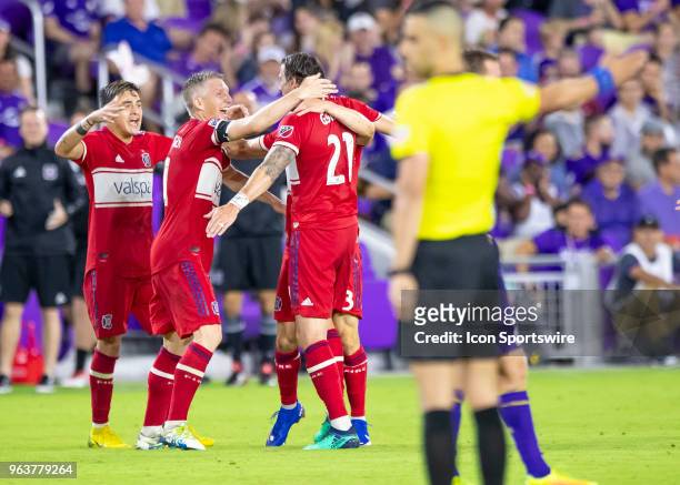Chicago Fire forward Alan Gordon celebrates with Chicago Fire midfielder Bastian Schweinsteiger as the referee signals goal during the MLS soccer...