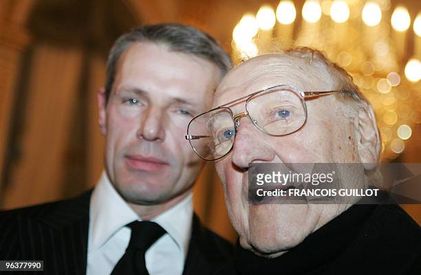 Picture taken on February 7, 2007 in Paris shows actor and theater director Georges Wilson flanked by his son, actor Lambert Wilson . Georges Wilson...