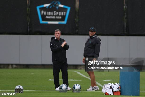 Marty Hurney and Ron Rivera chat before the start of the OTA at the Carolina Panthers training facility in Charlotte, N.C. On May 29, 2018.