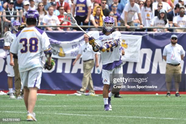 Albany Justin Reh classes the ball to Albany Sean Eccles . During the Albany Great Danes game against the Yale Bulldogs at Gillette Stadium on May...
