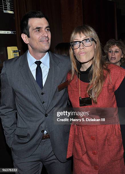 Actor Ty Burrell and Holly Burrell pose for pictures before ringing the opening bell at the New York Stock Exchange on February 3, 2010 in New York...