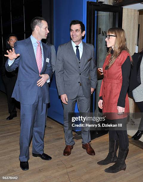 Executive Vice President of global corporate client group of NYSE Scott R. Cutler, Actor Ty Burrell and Holly Burrell pose for pictures before...