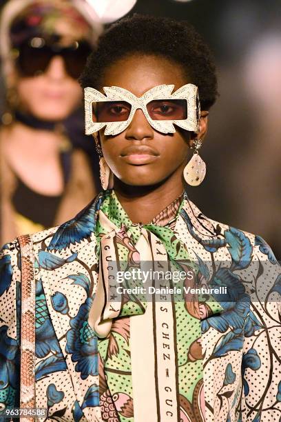 Model, sunglasses detail, walks the runway at the Gucci Cruise 2019 show at Alyscamps on May 30, 2018 in Arles, France.