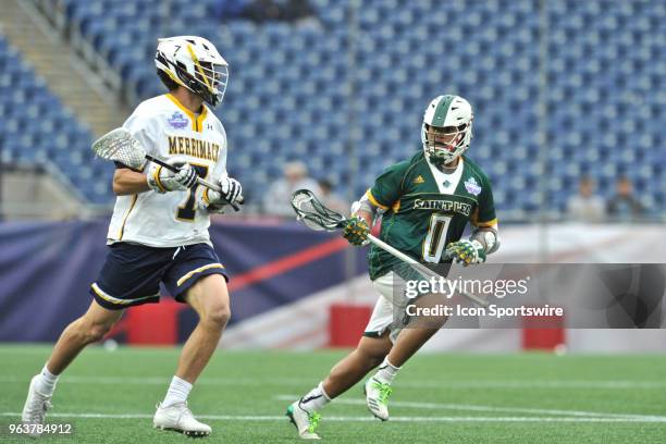 Saint Leo University Philip Buque stalkes Merrimack College Hunter Schmell to try and steal the ball. During the Saint Leo Lions game against...