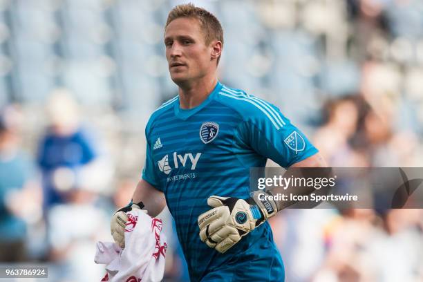 Sporting Kansas City goalkeeper Tim Melia jogs to his position during the MLS regular season match between Sporting Kansas City and the Columbus Crew...