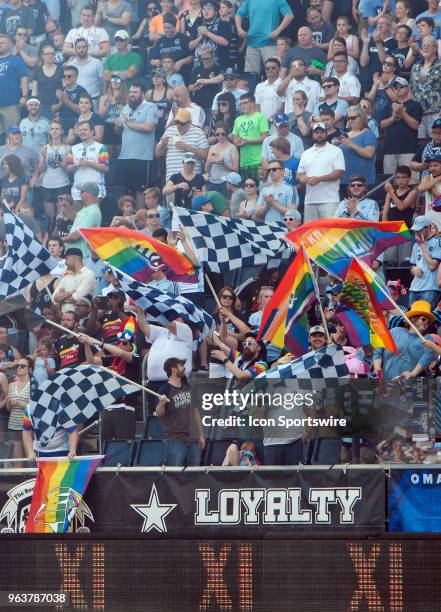 Members of the South Stand supporters group waves rainbow flags in honor of the Kansas City Wizards during SKC Retro night before the MLS regular...