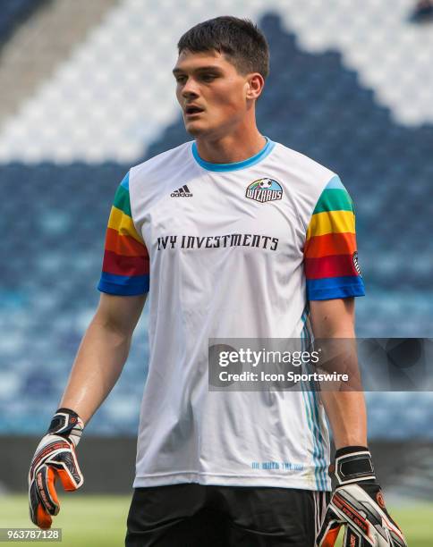 Sporting Kansas City goalkeeper Eric Dick wears a retro warmup in honor of the Kansas City Wizards before the MLS regular season match between...