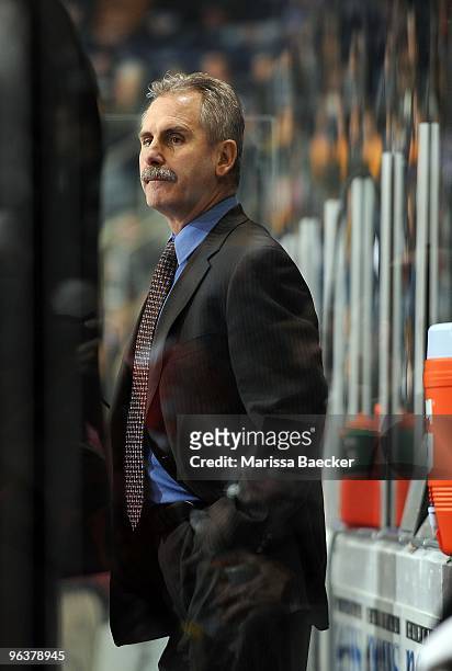 Willie Desjardins, Head Coach of the Medicine Hat Tigers stands on the bench against the Kelowna Rockets at Prosera Place on January 30, 2010 in...