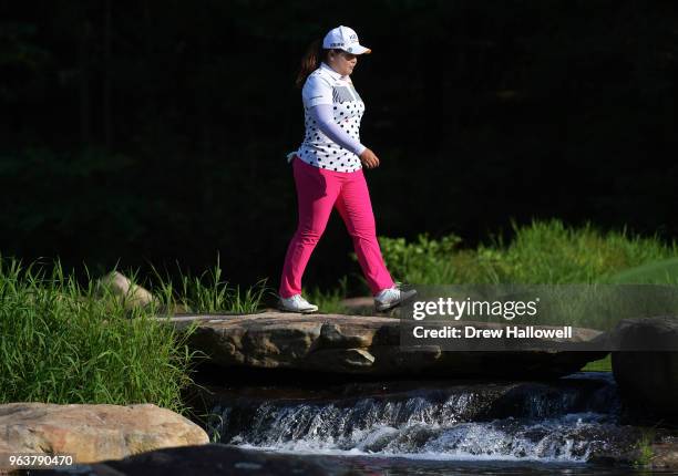 Inbee Park of Korea walks across a bridge to the 17th hole during a practice round prior to the 2018 U.S. Women's Open at Shoal Creek on May 30, 2018...