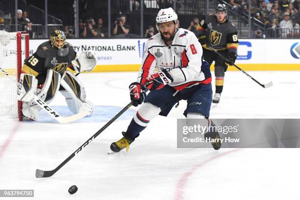 Alex Ovechkin of the Washington Capitals is pursued by Nate Schmidt of the Vegas Golden Knights during the first period in Game Two of the 2018 NHL...