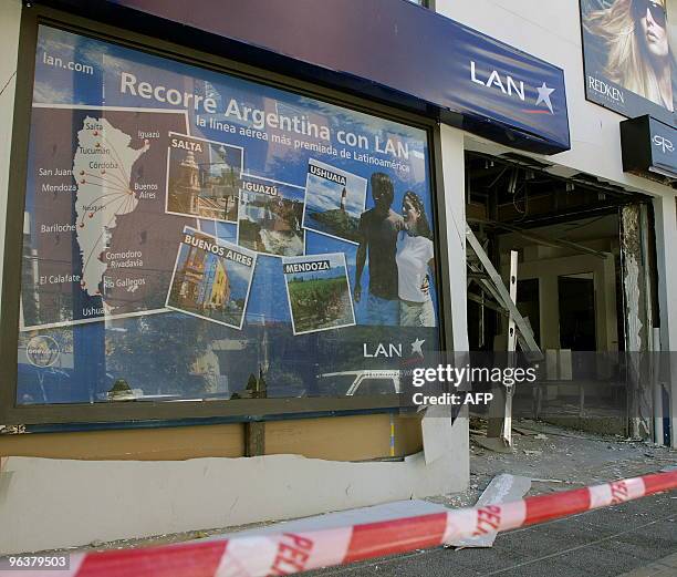 Office is seen destroyed by a bomb in Neuquen, Argentina, some 660 Kms from Santiago, Chile on February 3, 2010. A note was found at the scene of the...