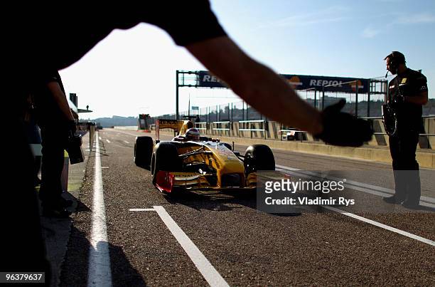 Vitaly Petrov of Russia and Renault drives in for a pit stop during winter testing at the Ricardo Tormo Circuit on February 3, 2010 in Valencia,...
