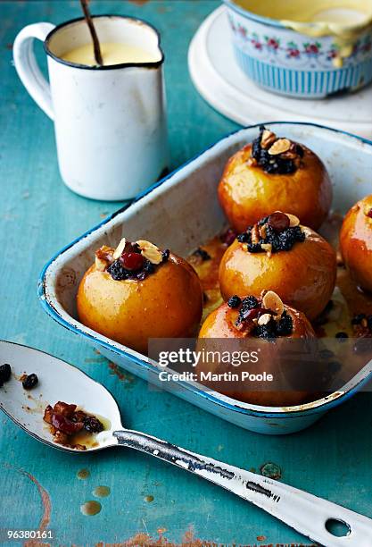 baked apples in baking tray with custard - martin poole stock pictures, royalty-free photos & images