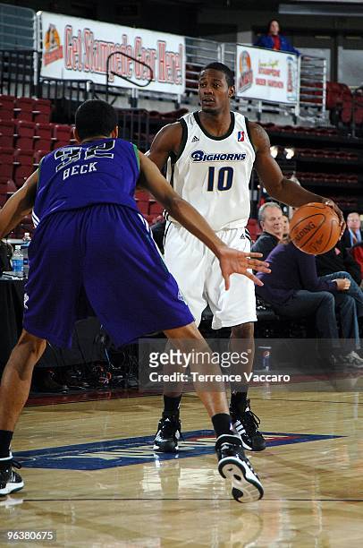 Dave Noel of the Reno Bighorns drives the ball against Romel Beck of the Dakota Wizards during the D-League game on January 4, 2010 at Qwest Arena in...