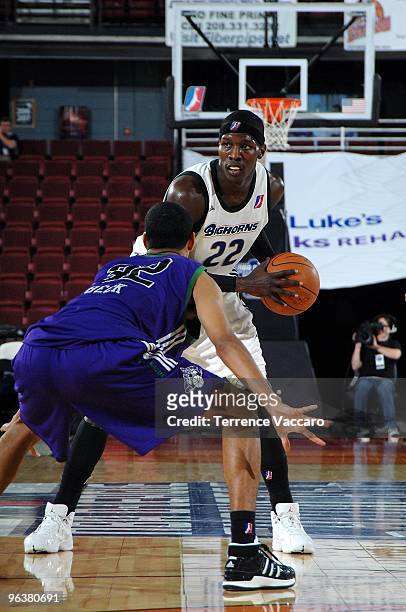 Mo Charlo of the Reno Bighorns drives the ball against Romel Beck of the Dakota Wizards during the D-League game on January 4, 2010 at Qwest Arena in...