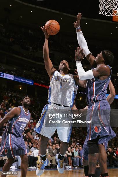 Chauncey Billups of the Denver Nuggets goes to the basket against Gerald Wallace of the Charlotte Bobcats during the game on January 25, 2010 at the...