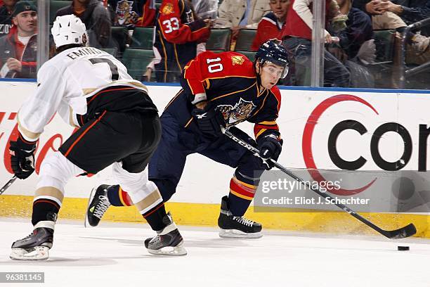 David Booth of the Florida Panthers passes the puck against Steve Eminger of the Anaheim Ducks at the BankAtlantic Center on February 1, 2010 in...