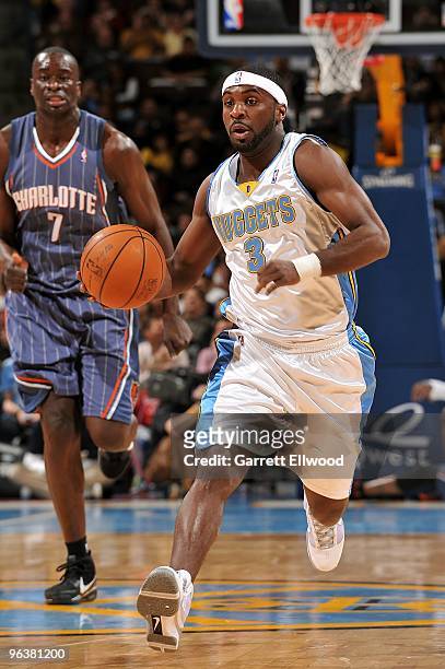 Ty Lawson of the Denver Nuggets drives the ball downcourt against the Charlotte Bobcats during the game on January 25, 2010 at the Pepsi Center in...