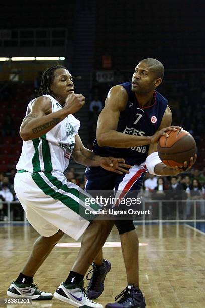 Charles Smith, #7 of Efes Pilsen Istanbul competes with and David Hawkins, #34 of Montepaschi Siena competes with in action during the Euroleague...