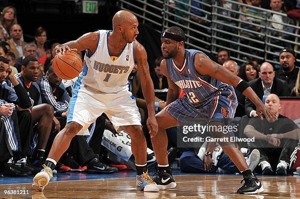 Chauncey Billups of the Denver Nuggets handles the ball against Ronald Murray of the Charlotte Bobcats during the game on January 25, 2010 at the...