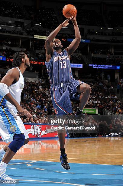 Nazr Mohammed of the Charlotte Bobcats goes to the basket against Nene of the Denver Nuggets during the game on January 25, 2010 at the Pepsi Center...