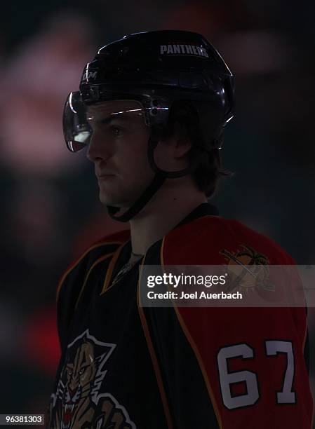 Michael Frolik of the Florida Panthers stands on ice during the national anthem prior to the game against the Anaheim Ducks on February 1, 2010 at...