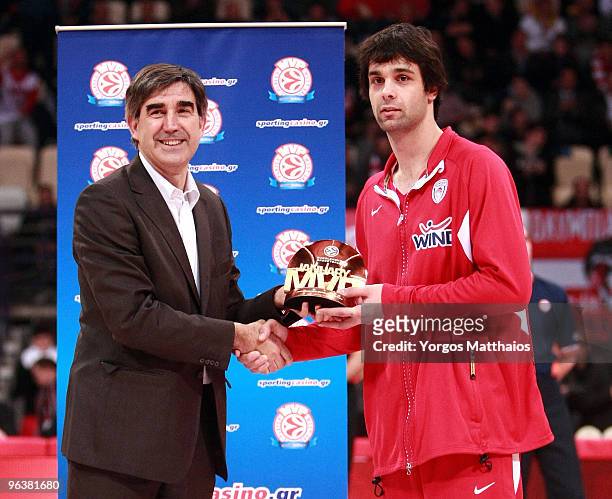 Milos Teodosic, #18 of Olympiacos Piraeus, MVP of January, and Jordi Bertomeu during the Euroleague Basketball 2009-2010 Last 16 Game 2 between...
