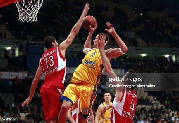 Robertas Javtokas, #15 of BC Khimki Moscow Region competes with Panagiotis Vasilopoulos, #13 of Olympiacos Piraeus during the Euroleague Basketball...