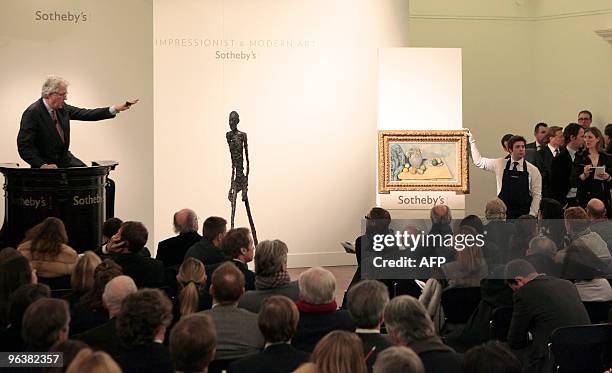 Sotheby's employee auctions Alberto Giacometti's sculpture "L'Homme qui marche" and French impressionist Paul Cezanne 'Pichet et fruits sur une...