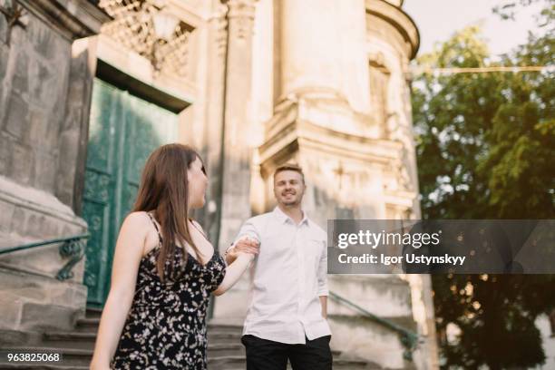 photo of a lovely couple resting in the city - lviv oblast stock pictures, royalty-free photos & images