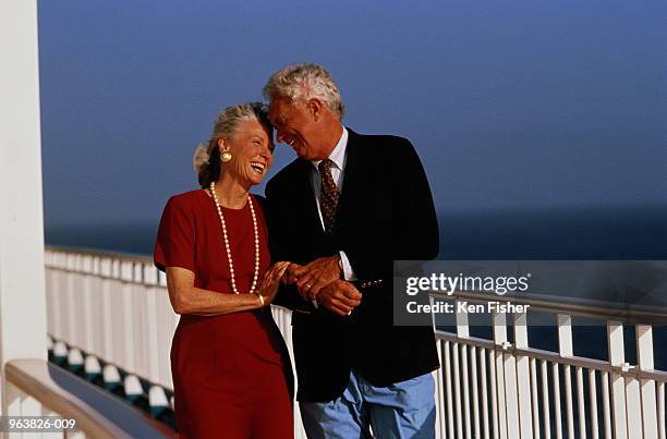 mature couple on deck of cruise ship - couple on cruise ship stock pictures, royalty-free photos & images