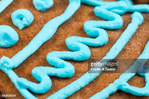 blue glaze gingerbread cookie close up shot - ginger snap stock pictures, royalty-free photos & images