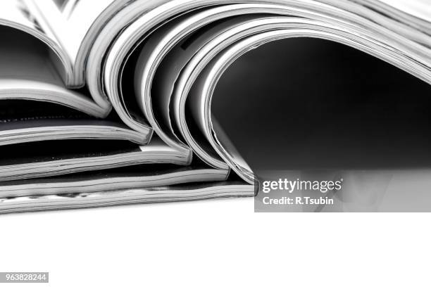 stack of magazines on white background with reflection - advertising column stock pictures, royalty-free photos & images