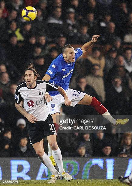 Fulham's Johnathan Greening and Portsmouth's Hassan Yebda compete during their Premiership match at home to Fulham at Craven Cottage football stadium...